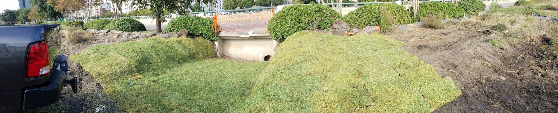 Sodded mounds along a finished commercial drive