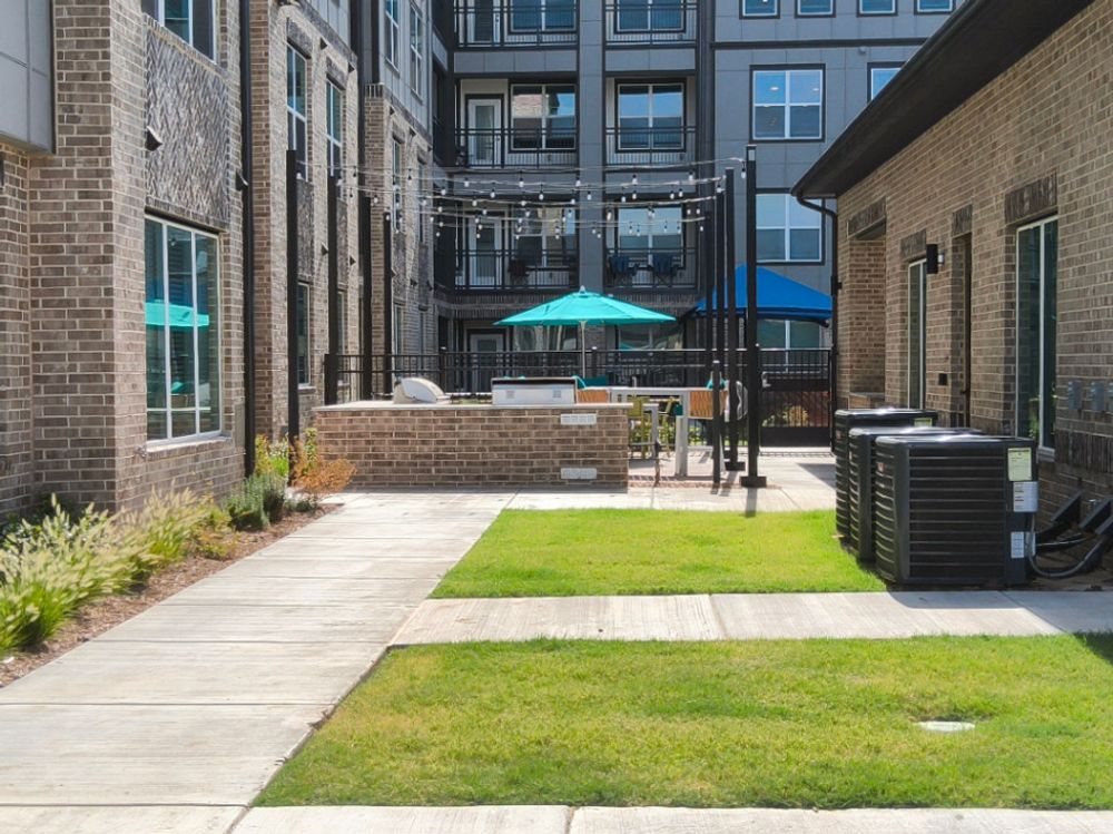 Established sod and landscaping at final stabilization on a Celina multifamily project
