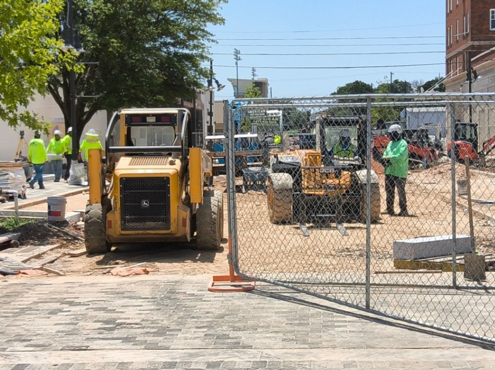 Downtown Denison streetscape construction inside its perimeter fencing