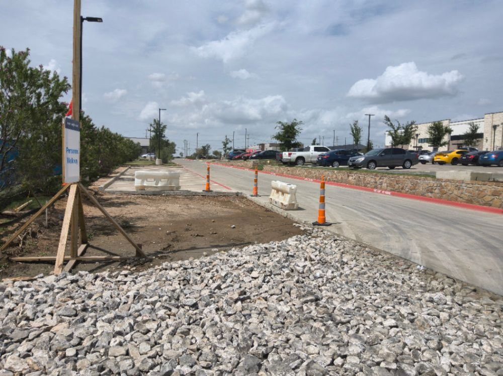 Stabilized rock construction entrance at a Prosper retail development