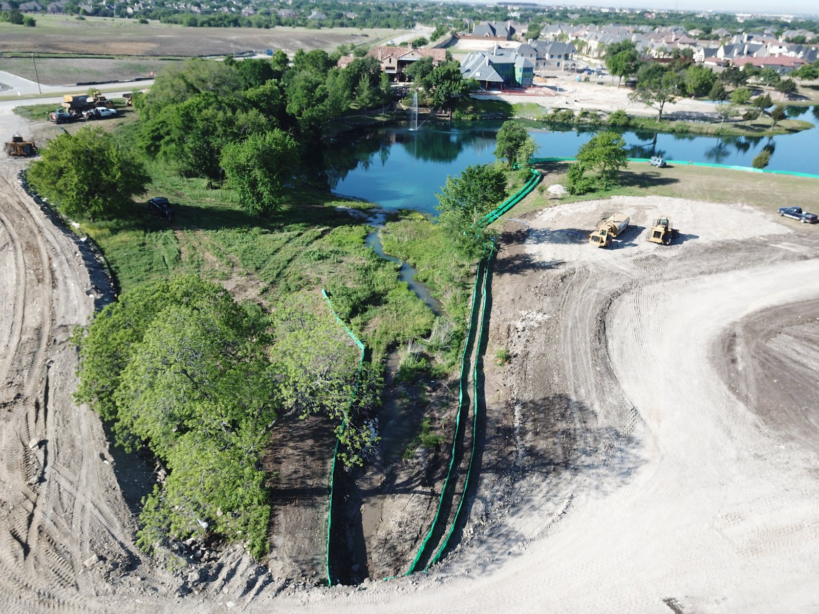 Drone aerial — active perimeter protecting a pond